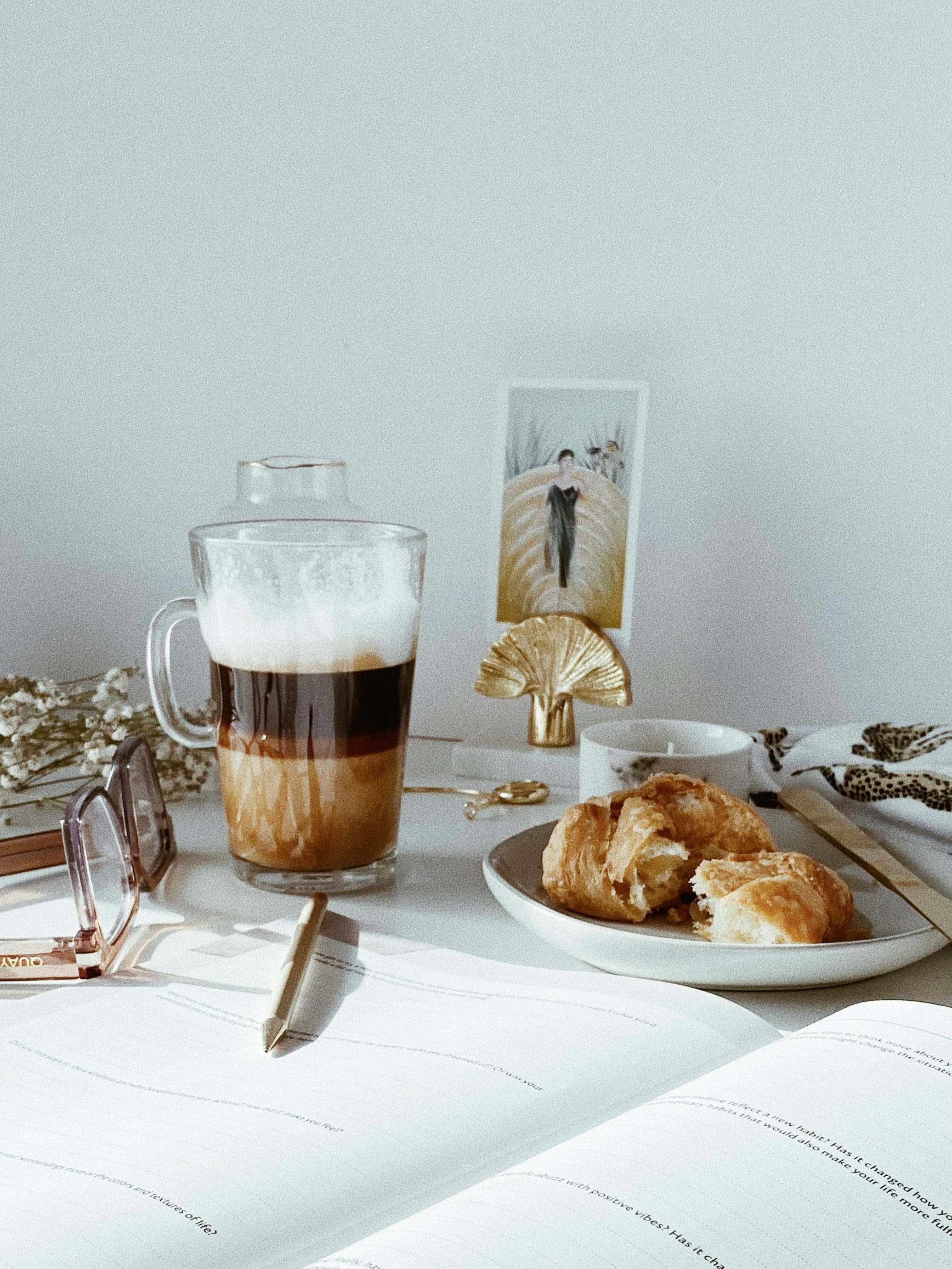 clear glass mug with brown liquid